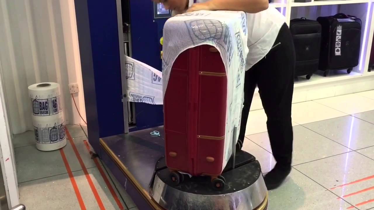 secure travel luggage wrapping and weighing