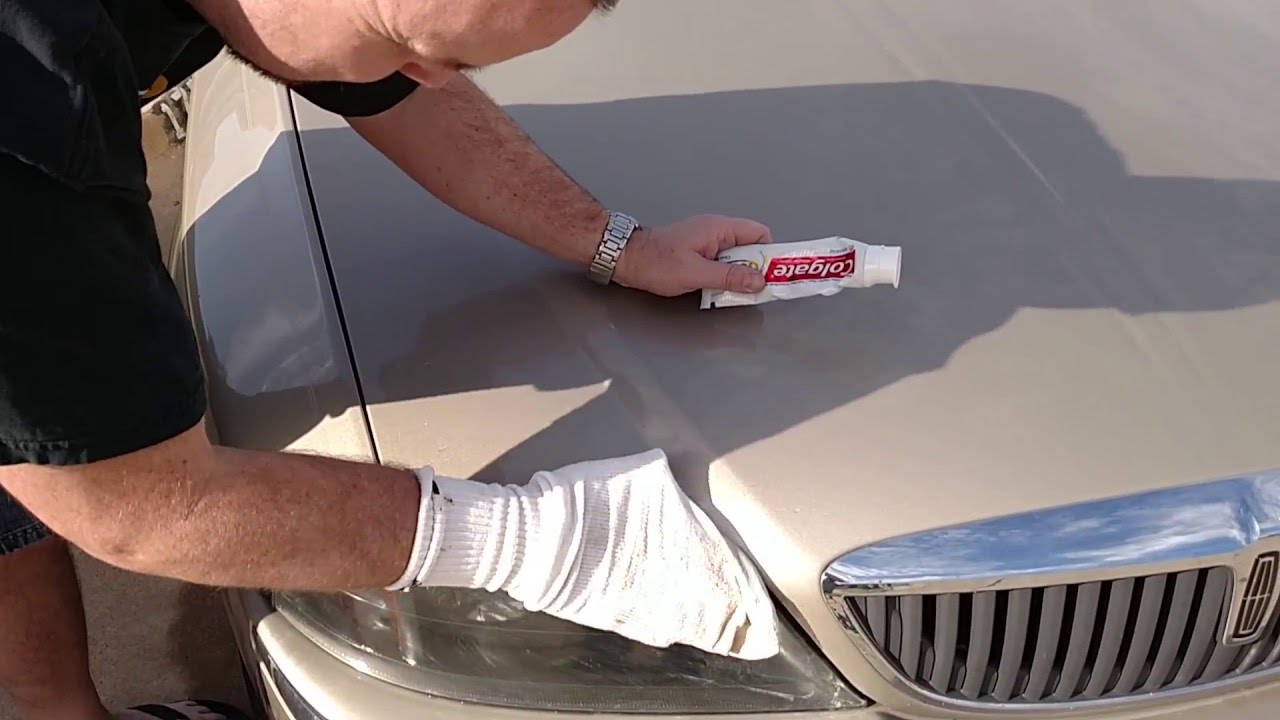 Using Toothpaste to clean the headllights on a car.