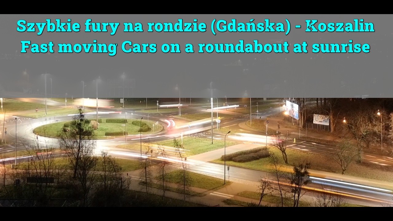 fast-moving cars on a roundabout at sunrise