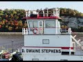 Trick or towboat with some fall colors along the bluffs at elsah illinois