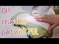Sewing a reusable heavy pad with a hidden layer of PUL.