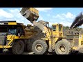 Cat power at work  caterpillar 992c loading 777fs