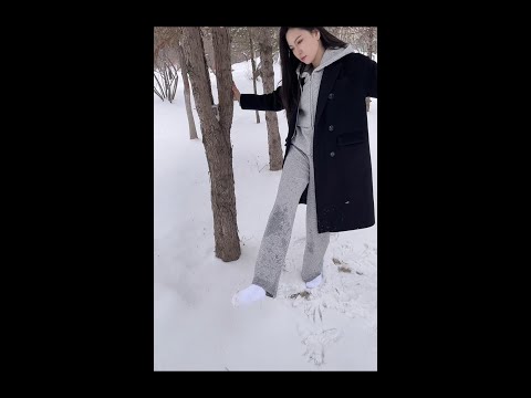 Buan was strolling in the snow with only her socks on and her socks got very wet