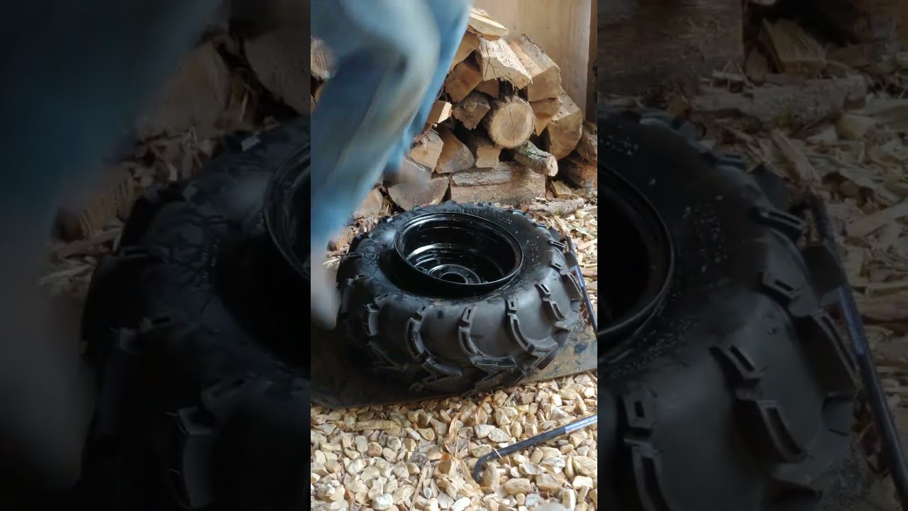 Changing atv tire by hand 