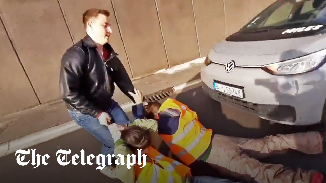 Drivers drag climate activists off streets in Berlin