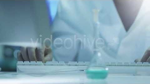 Scientist is Working on Computer in Laboratory 2 - Stock Footage | VideoHive 11003971