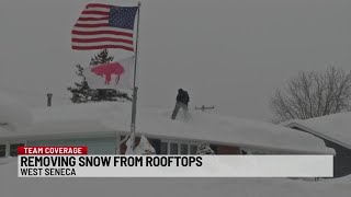 West Seneca residents remove snow from rooftops