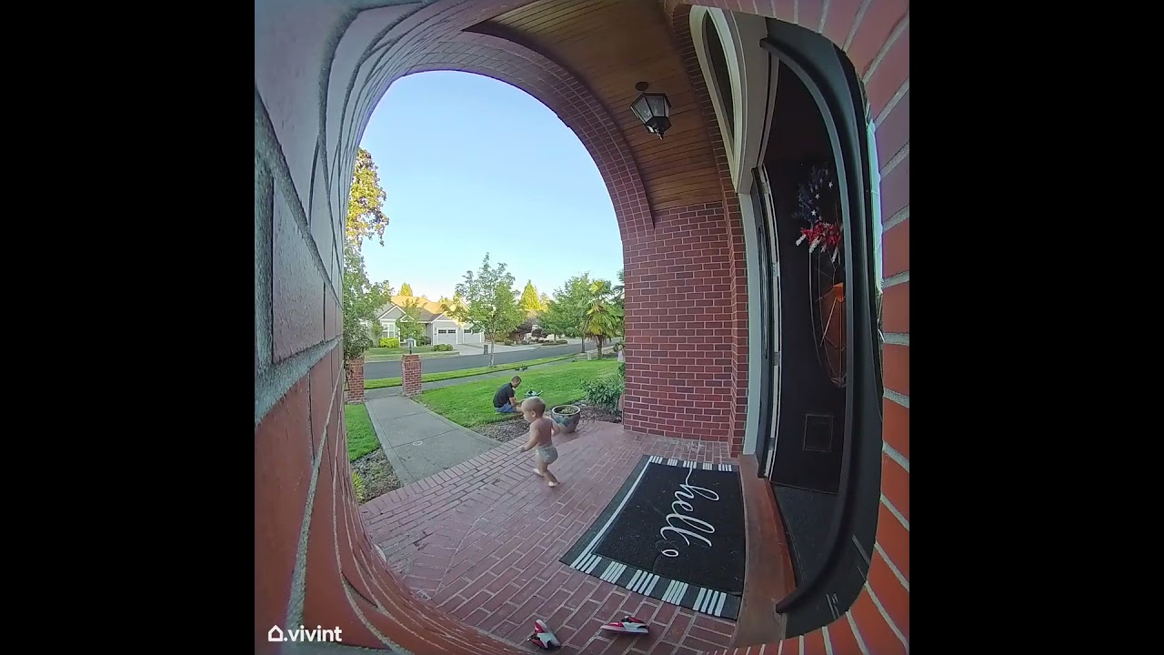 Baby boy in diaper runs out of front door of house then falls and flips downstairs (Security camera)