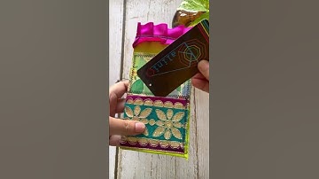 Boho junk journal using fabric and paper scraps and paper bags embellished pocket with sari trim