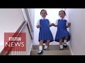 Twins conjoined at birth and "unlikely to survive" start school - BBC News