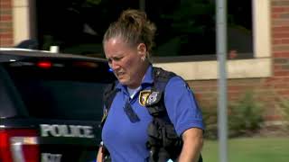 Police Search for Suspects After Bank Shooting