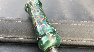 Resin and pine cone duck call