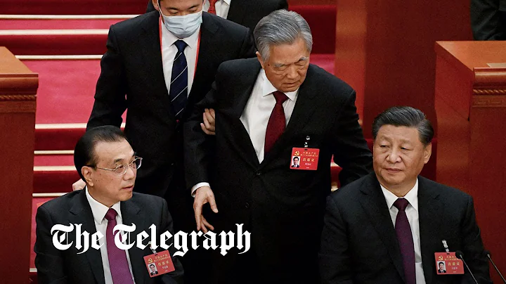 Former Chinese President Hu Jintao escorted out of...