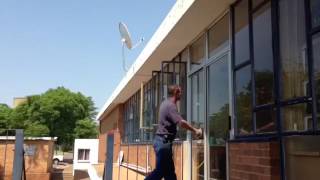 Man walking into glass door.