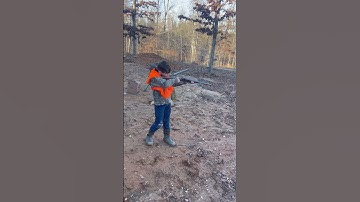 My brother pulling both triggers on the double barrel shotgun