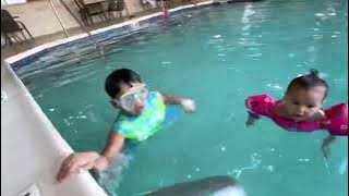 SIBLINGS BONDING AT THE POOL