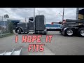 Stretched 2022 389 Peterbilt backing into tight Seattle shop with front overhanging steel beams