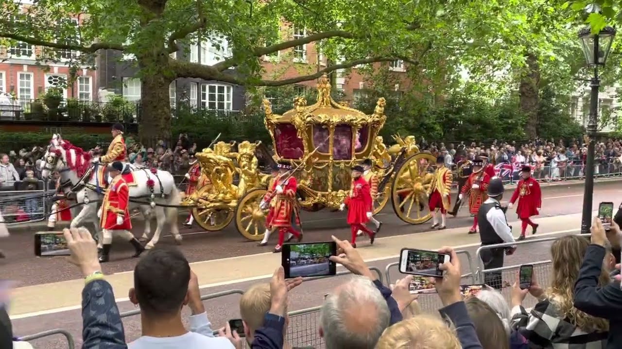 Queen Elizabeth’s golden carriage of state goes by on the Platinum Jubilee