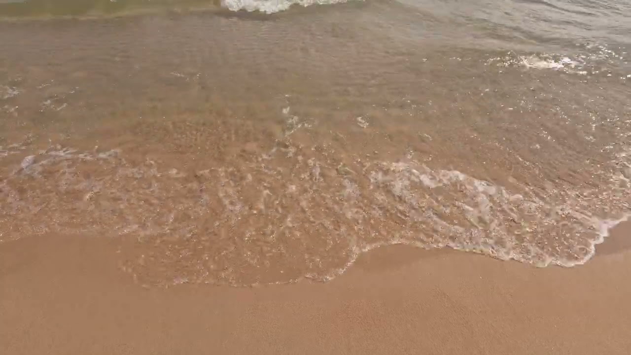 Waves washing ashore on a Lake Huron beach along Michigan's M134.
