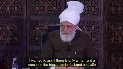 Where does the wife stand if she is praying with her husband?