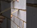 a mortar to the gaps between blocks with a trowel to build a solid and sturdy brick wall