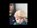 Dad Puts Baby to Sleep by Sliding Hand on Face - 1021454
