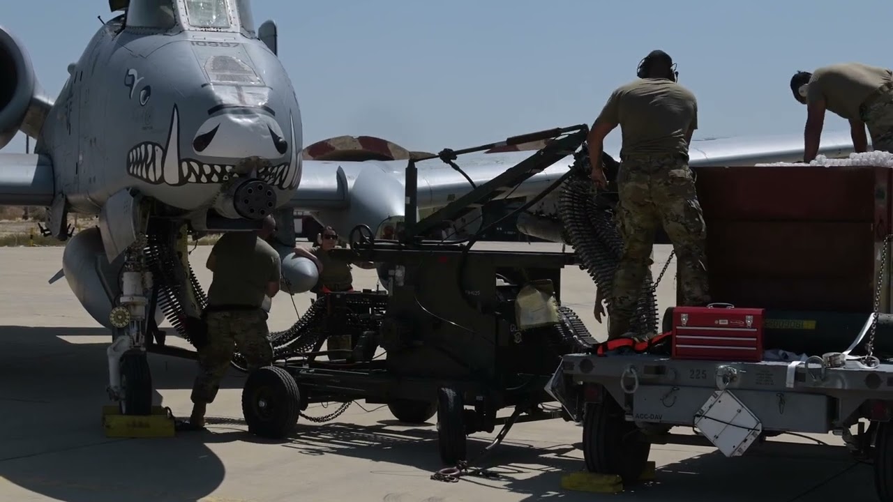 A-10 crew demonstrates loading ammunition