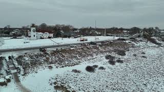 Chatham, Cape Cod Lighthouse Aerial with Snow in Winter Storm, stock footage #499b