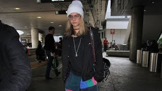Cara Delevingne Looking Cute In Beanie And Colorful Pants At LAX Cara Delevingne Looking Cute In Beanie And Colorful Pants At LAX