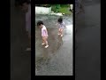 Twin Babies Having Fun in the Rain β