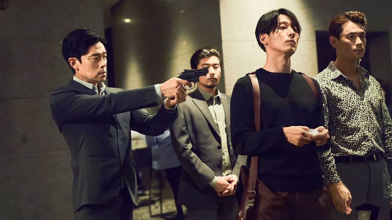 The Gangster Points a Gun at Him, Unaware That He is the Most Sadistic
