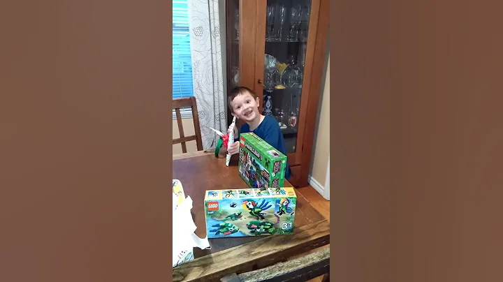 Dominic opening presents from Great Uncle John and...