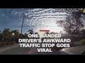One-handed woman's awkward traffic stop goes viral