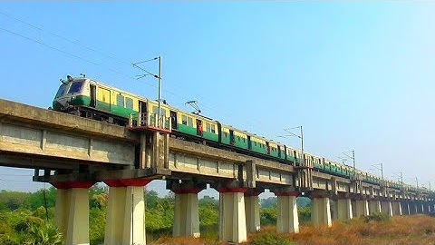 EMU local trains crossing long rail bridge over rail line || EASTERN RAILWAY
