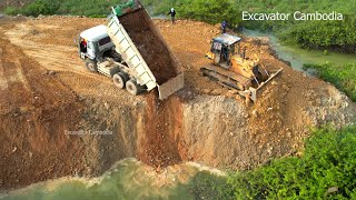 Excellent Dump Truck Waiting Working Unloading Dirt Back Fill Lake And Two Heavy Dozer Pushing Dirt