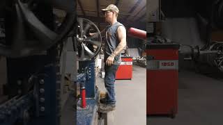 Alex fixing, bending, strengthening rims at the wheel exchange. $13hr.