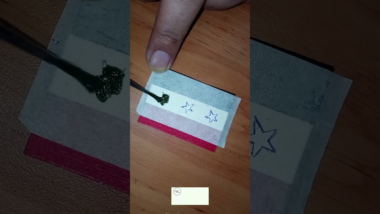 Passing through history: Painting of the old flag of Iraq