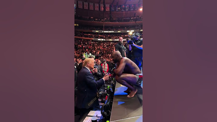 Jon Jones hands over his ufc belt to President of USA Donald Trump after his victory vs Stipe Miocic