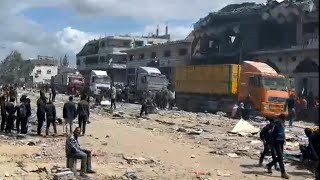 Humanitarian aid trucks arrive in Gaza City before heading north | AFP