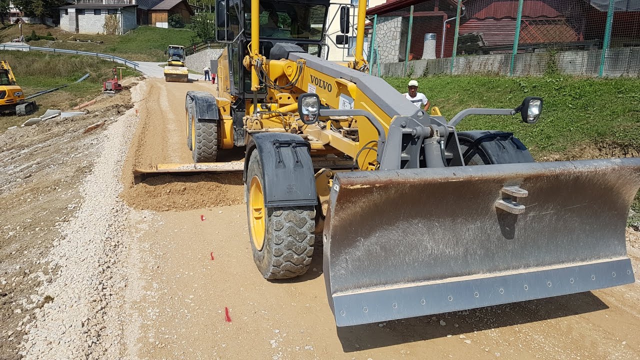 Motor Grader Making A Road Outflow -Skilled operator