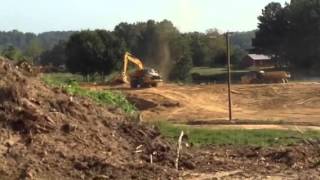 Cat 349E loading Cat 740B