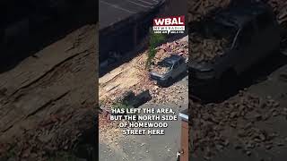 Partial building collapse buries parked cars under bricks in East Baltimore
