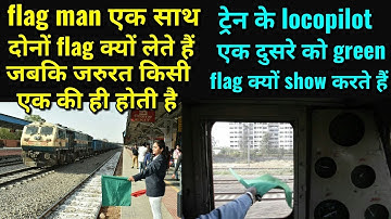 why do loco pilots wave green flags when two trains are crossing each other