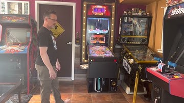 Opening the folding virtual pinball table and putting it away again.