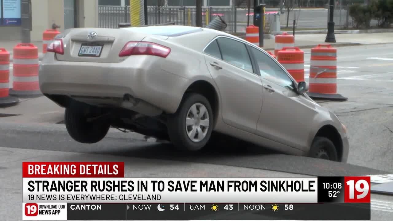 Massive sinkhole in downtown Cleveland nearly swallows car
