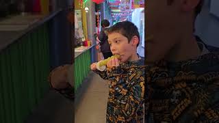 Eli eats Tanghulu for the first time