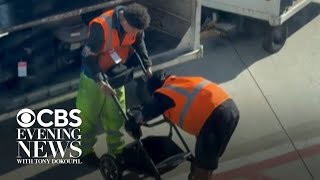 Bystanders cheer for baggage handlers after they finally fold baby stroller Wealth