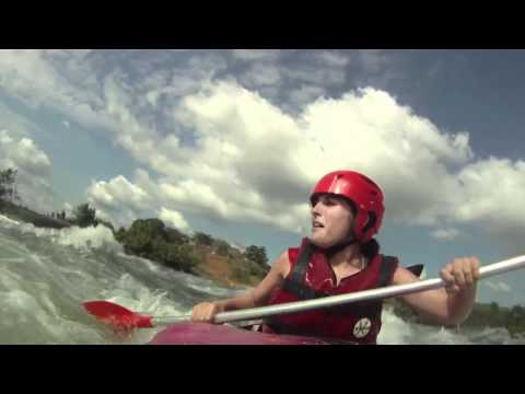 Funny scared girl running grade 5 rapid Itanda falls in a tandem kayak