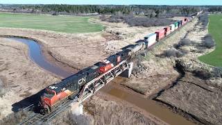 Awesome Aerial View in 4K! Long Stack Train CN 120 w/DPU passing Nappan, NS at Track Speed