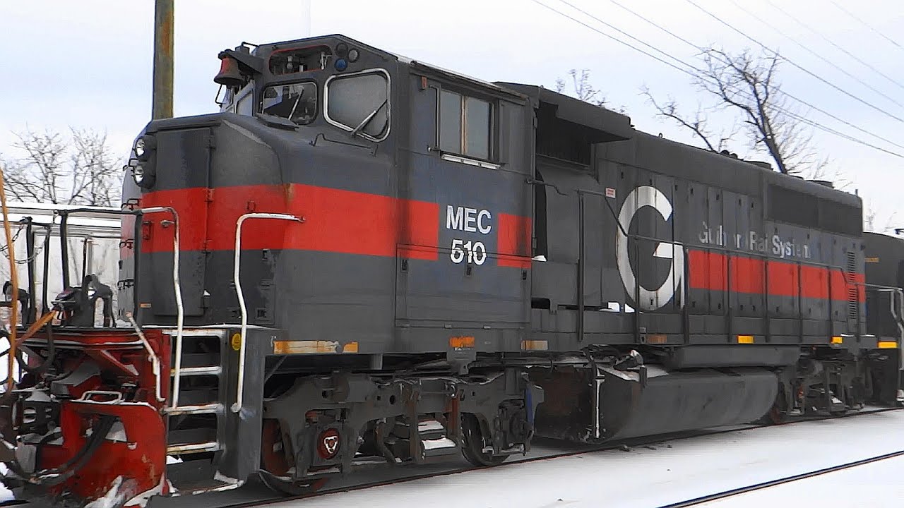 CSX Freight Train Hauls an EMD in Guilford Rail System Livery
